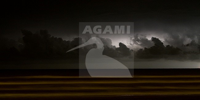 Bliksem boven zee, Lightning over sea stock-image by Agami/Menno van Duijn,