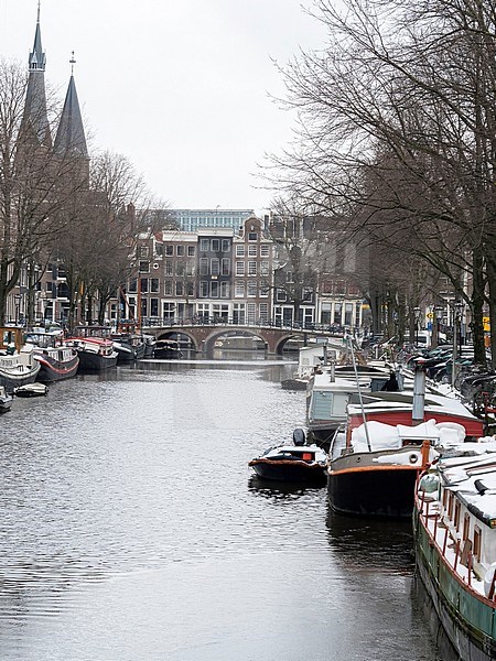 Canals of Amsterdam in wintertime with snow covered boats and houses stock-image by Agami/Roy de Haas,