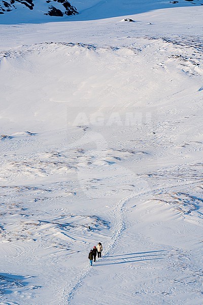Locals walking on a trail to the Ilulissat Icefjord, an UNESCO World Heritage Site. Ilulissat Icefjord, Ilulissat, Greenland. stock-image by Agami/Sergio Pitamitz,