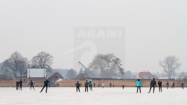 People on skates in white landscape stock-image by Agami/Menno van Duijn,