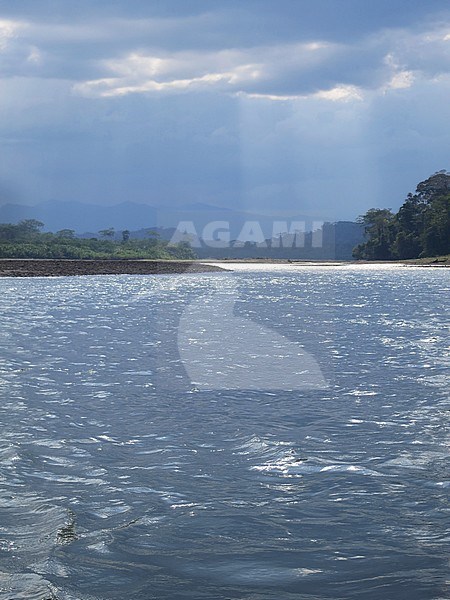 Dark rain clouds over the Alto Madre de Dios River in the Lower Amazon rainforest in Madre de Dios department in Peru. stock-image by Agami/Marc Guyt,