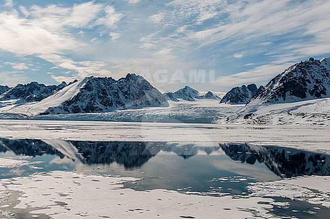 Monaco Glacier and its mirror reflection on arctic waters. Monaco Glacier, Spitsbergen Island, Svalbard, Norway. stock-image by Agami/Sergio Pitamitz,
