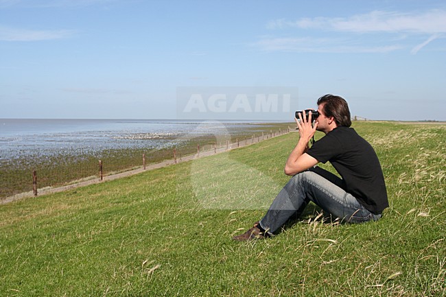 Vogelaar in actie; Birdwatcher in action stock-image by Agami/Marc Guyt,