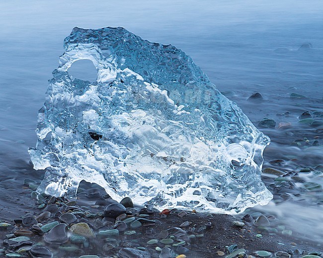 Diamond Beach, piece of ice  among pebbles on the beach stock-image by Agami/Saverio Gatto,