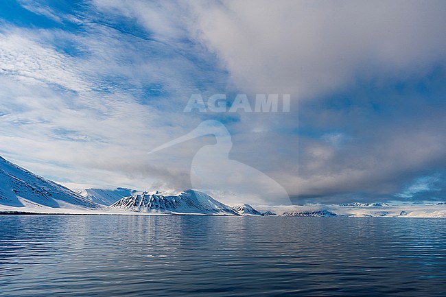 Snow covered mountains rise near the shore of Mushamna Bay. Spitsbergen Island, Svalbard, Norway. stock-image by Agami/Sergio Pitamitz,
