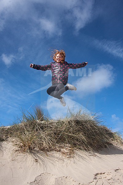 Jumping kids in the dunes on Texel, Netherlands stock-image by Agami/Bas Haasnoot,