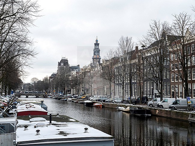 Wesyertoren (Amsterdam) in wintertime with snow covered boats and houses stock-image by Agami/Roy de Haas,