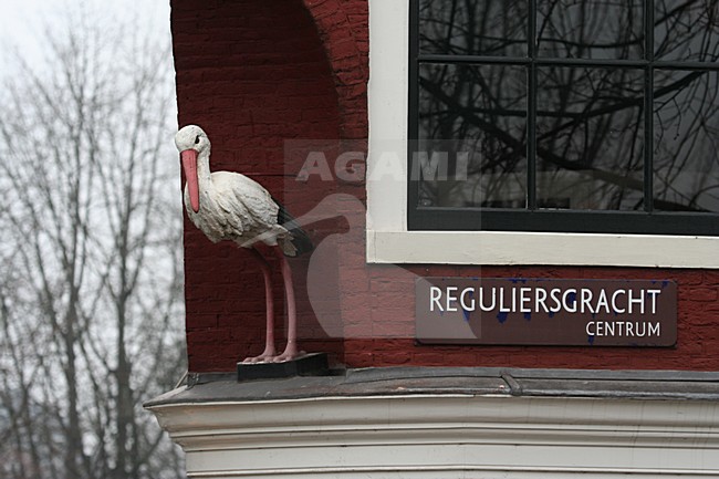 Statue of White Stork in Amsterdam; Gevelbeeld Ooievaar in Amsterdam stock-image by Agami/Marc Guyt,